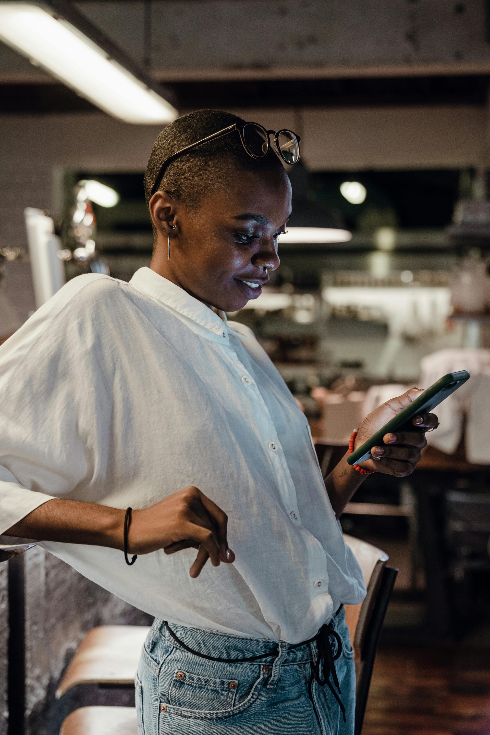 Woman looking at phone and smiling