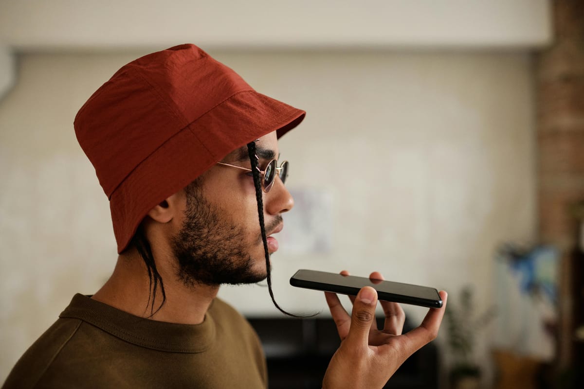A man leaving a voicemail on a phone